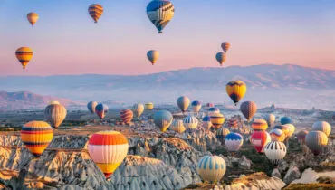 Aerial view of a fleet of hot air balloons, in Cappadocia, Turkey