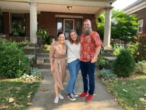 Family outside of their home