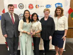 Global educator award winner receiving award at event.