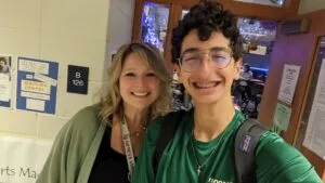 Teacher with student in school(1)