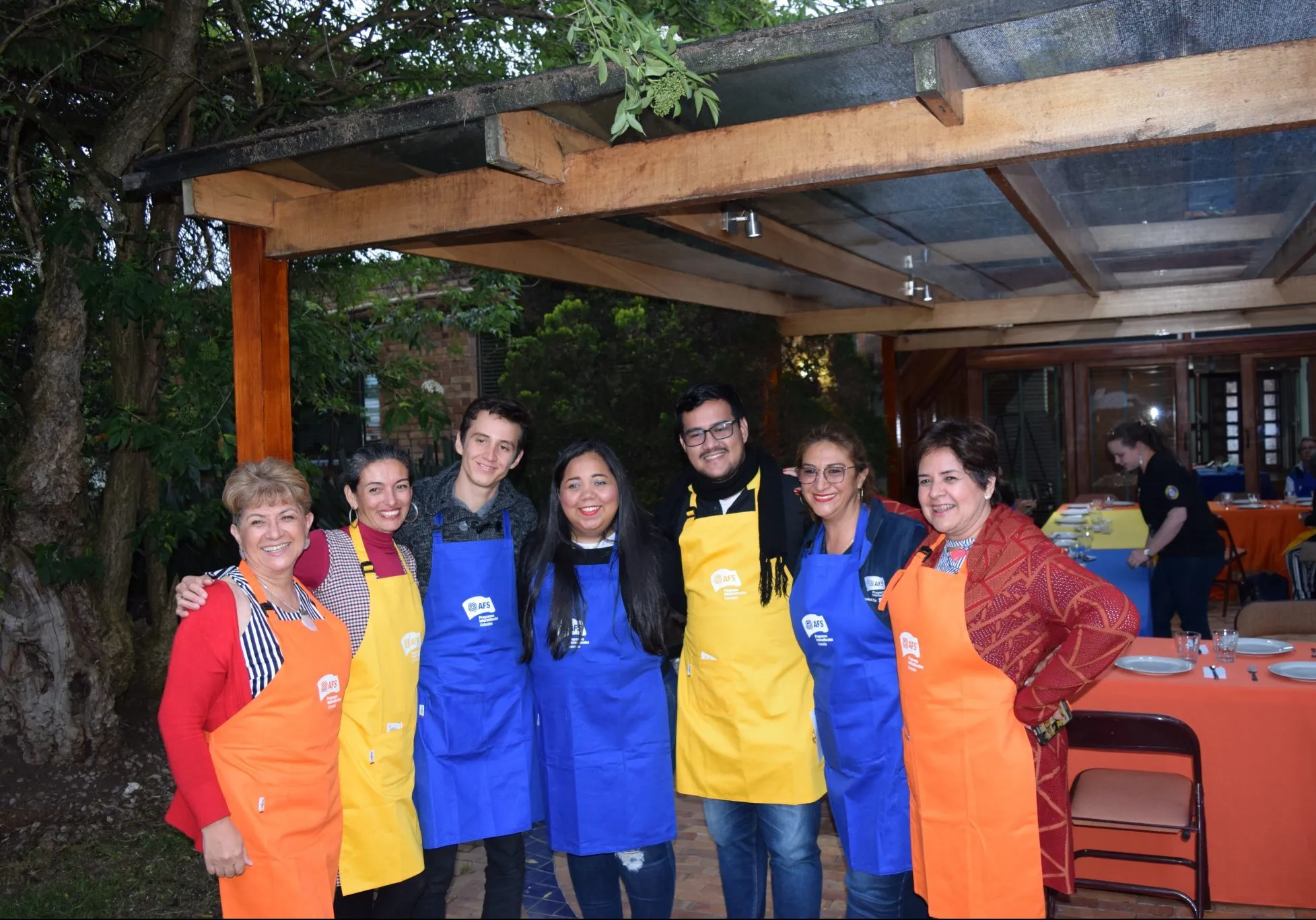 Volunteers of AFS Colombia with coloful aprons during the leadership development gathering.