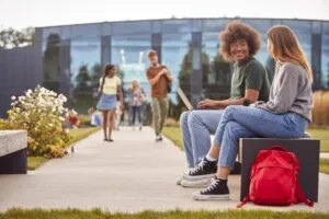 male-and-female-university-or-college-students-sit-2026-01-05-06-29-44-utc