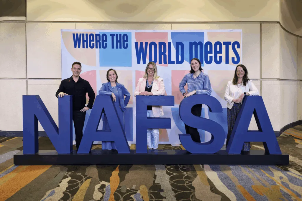 AFS Intercultural Programs delegation at NAFSA 2026, including representatives from AFS Canada and the Alianza Latinoamericana de Educación Intercultural, posing at the conference venue.