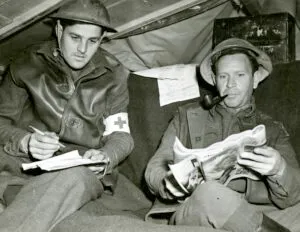 John Lester and Robert Charles DeRimsingeur in their dugout headquarters on the Anzio beachhead in Italy, April 1944. Photograph by George Holton.