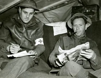 John Lester and Robert Charles DeRimsingeur in their dugout headquarters on the Anzio beachhead in Italy, April 1944. Photograph by George Holton.