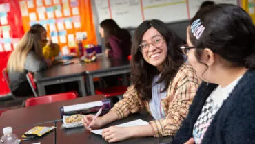 Two high school girls in a research class