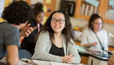 Girl smiling in chemistry class
