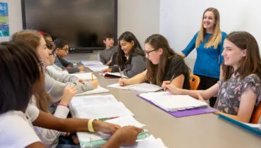 Middle school class around a table