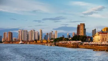 Mesmerizing view of the Brazilian cityscape with an ocean under a cloudy sky