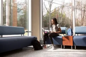 Female student studying in lobby