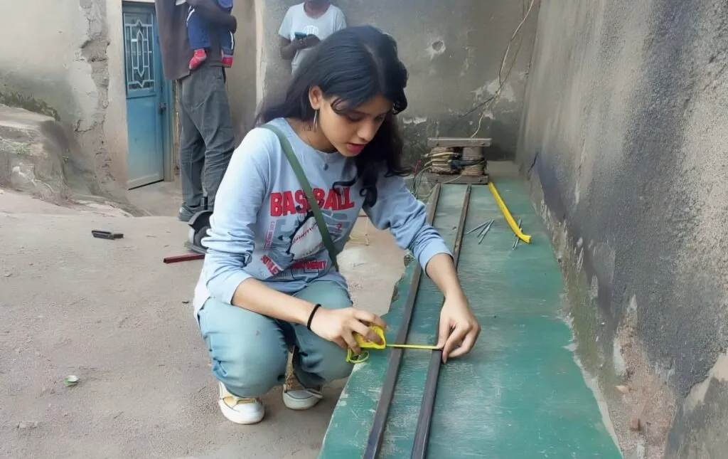 Khushi Upadhyay building her G.R.O.W. capstone project.