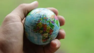 Globe in hand