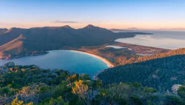 Sunrise nature landscape of beautiful ocean bay, lagoon and mountains. Wineglass bay in Tasmania, Australia