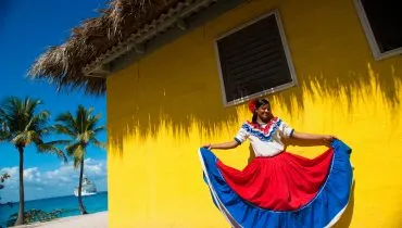 Catalina Island, Dominican Republic. A woman in traditional outf